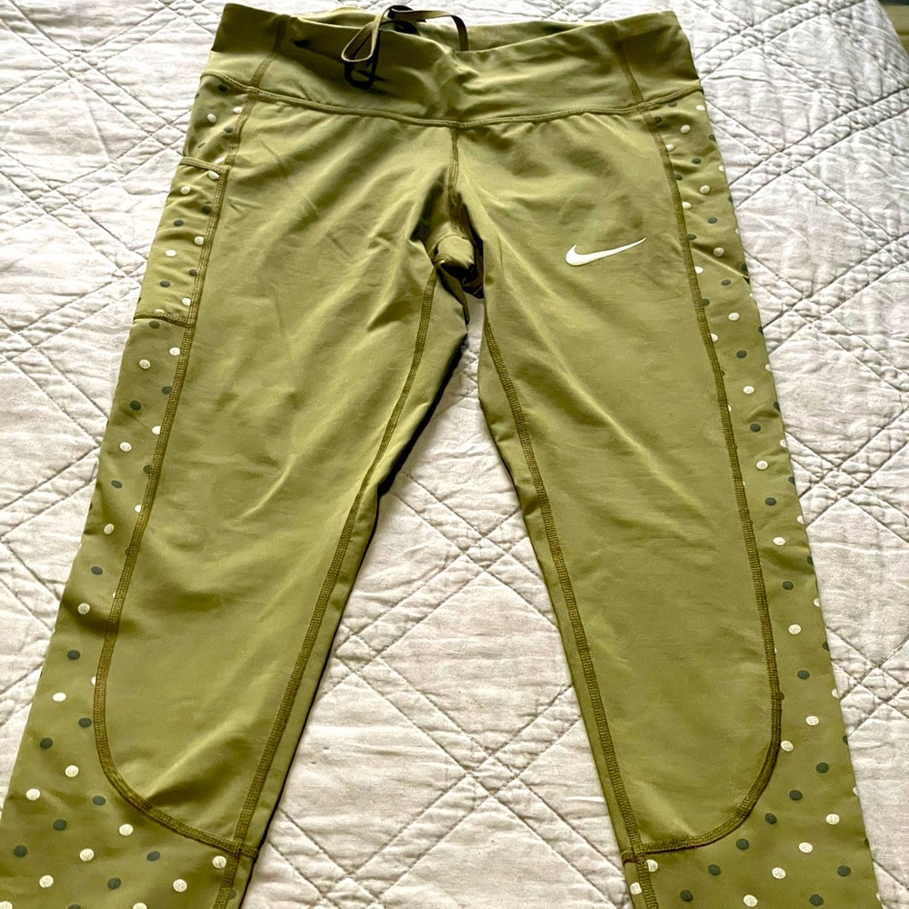 Green Nike leggings and guess camo pants